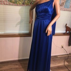 Elegant blue evening dress with one shoulder and rhinestone accent.